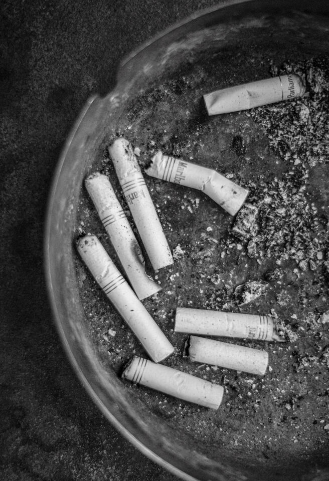 Cigarette butts in ashtray at Bar Mon Ami in Alamo Heights, Texas